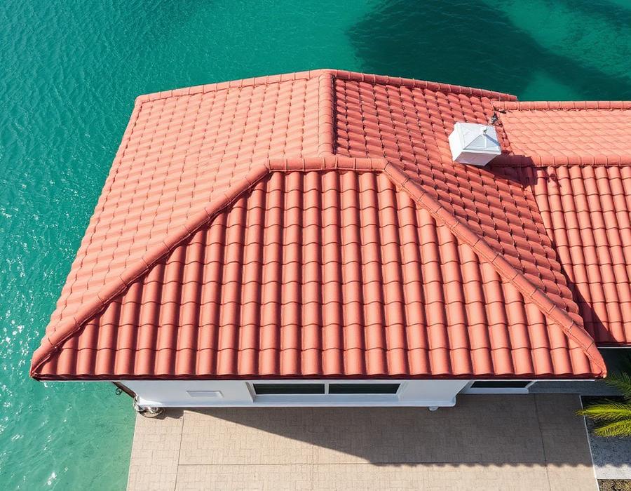 Aerial view of a finished barrel tile roof on a Miami coastal home